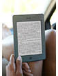 Kindle Touch e-reader: woman reading in car with Kindle Touch on lap