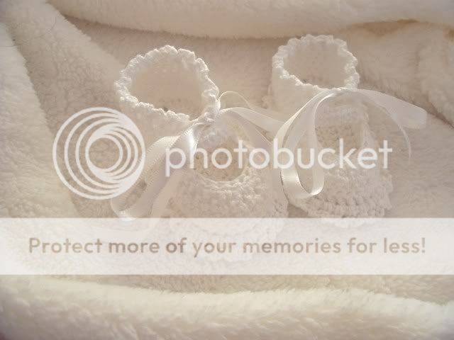 Beautiful white hand crocked baby booties