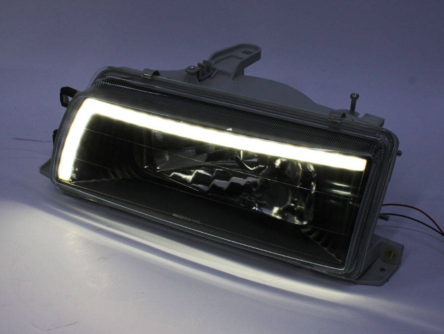 Toyota E8E9 Twincam Neon DRL Headlights with Smoke Finish (Pair)