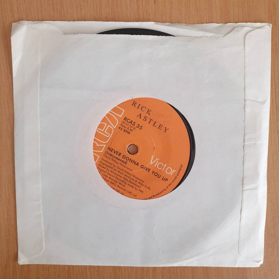 Rick Astley  Never Gonna Give You Up - 7" Vinyl Record  (VG+) (DLB)