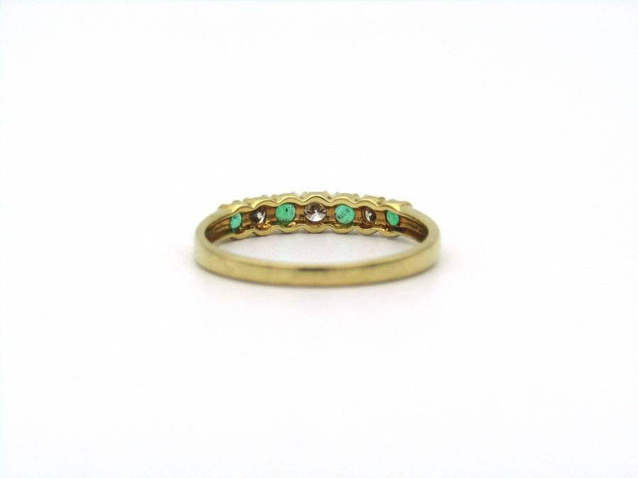 18K gold emerald and diamond ring.