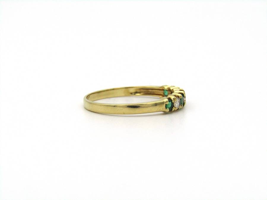 18K gold emerald and diamond ring.