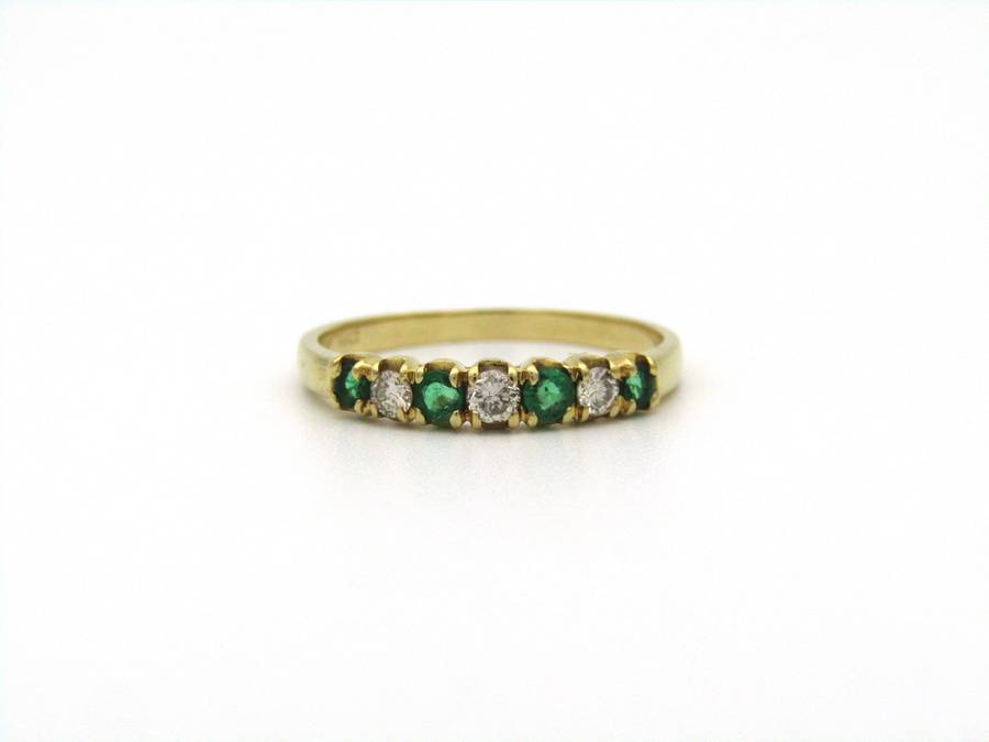 18K gold emerald and diamond ring.