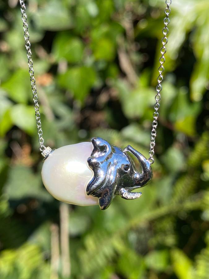 14K gold floating baroque pearl and diamond elephant necklace.