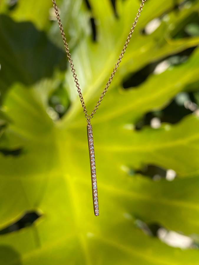 9K gold diamond bar necklace.