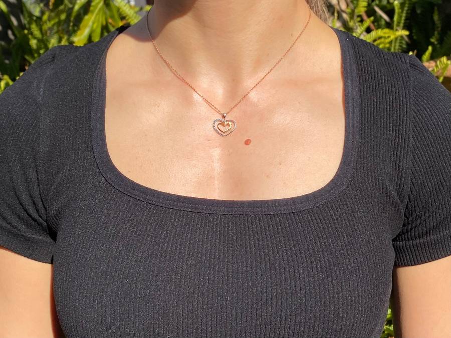 18K gold double-heart pendant.