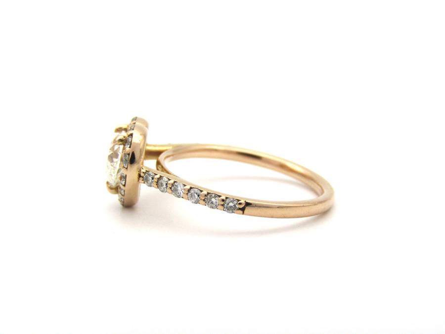 18K gold heart-shaped diamond halo ring.