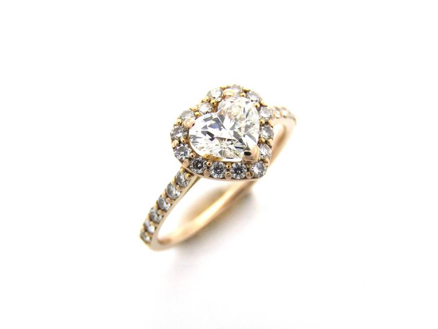 18K gold heart-shaped diamond halo ring.