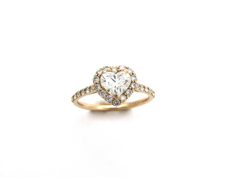 18K gold heart-shaped diamond halo ring.