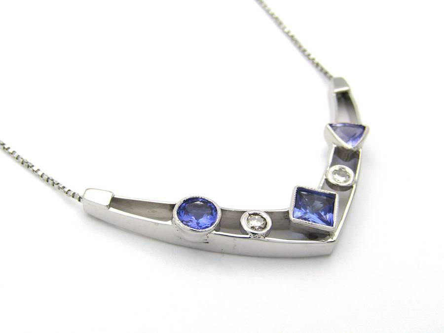 18K gold tanzanite and diamond necklace.