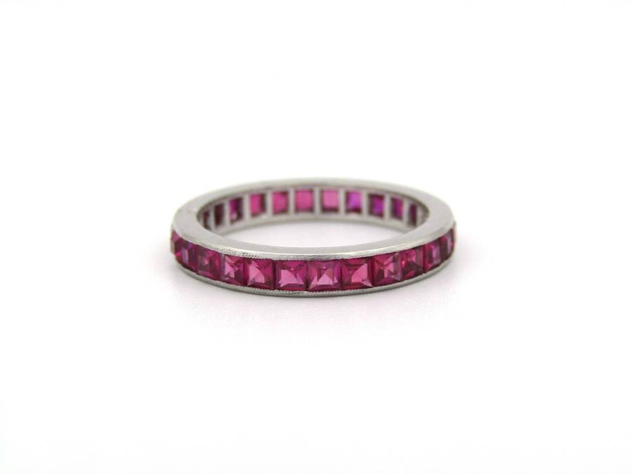 Platinum synthetic ruby eternity ring, circa 1990's.