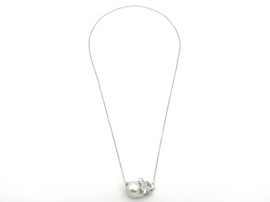 14K gold floating baroque pearl and diamond elephant necklace.