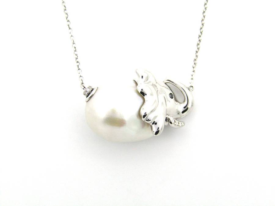 14K gold floating baroque pearl and diamond elephant necklace.