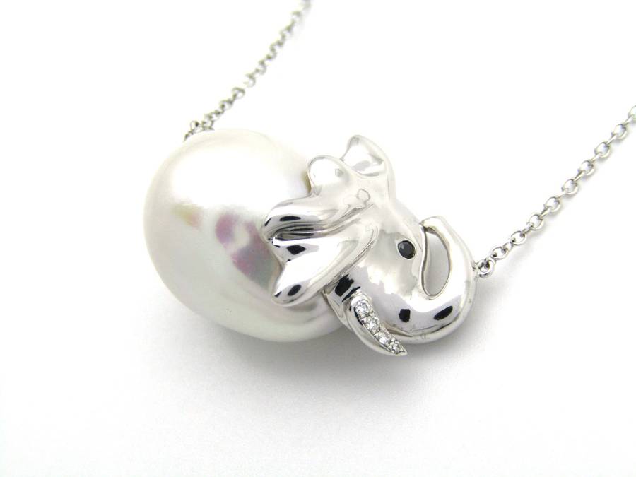 14K gold floating baroque pearl and diamond elephant necklace.