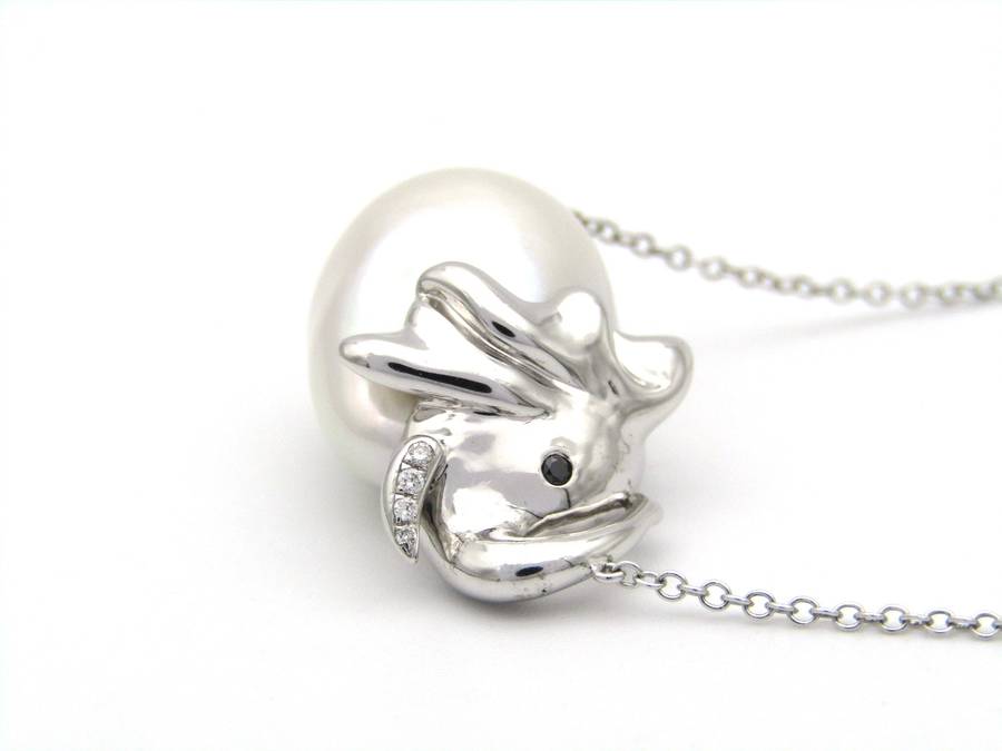 14K gold floating baroque pearl and diamond elephant necklace.