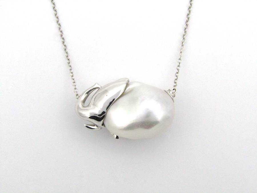 14K gold floating baroque pearl and diamond elephant necklace.