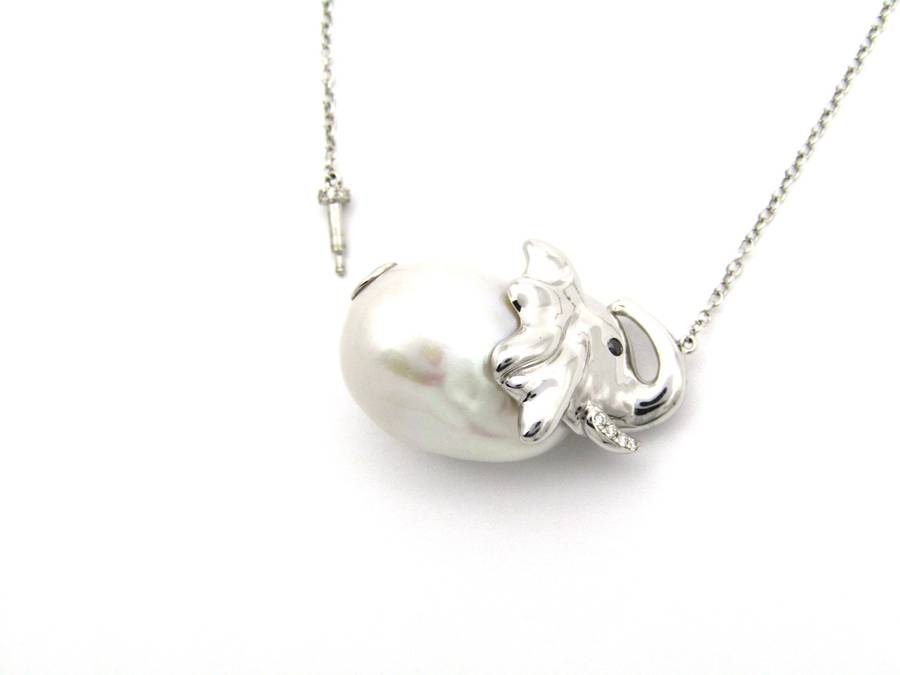 14K gold floating baroque pearl and diamond elephant necklace.