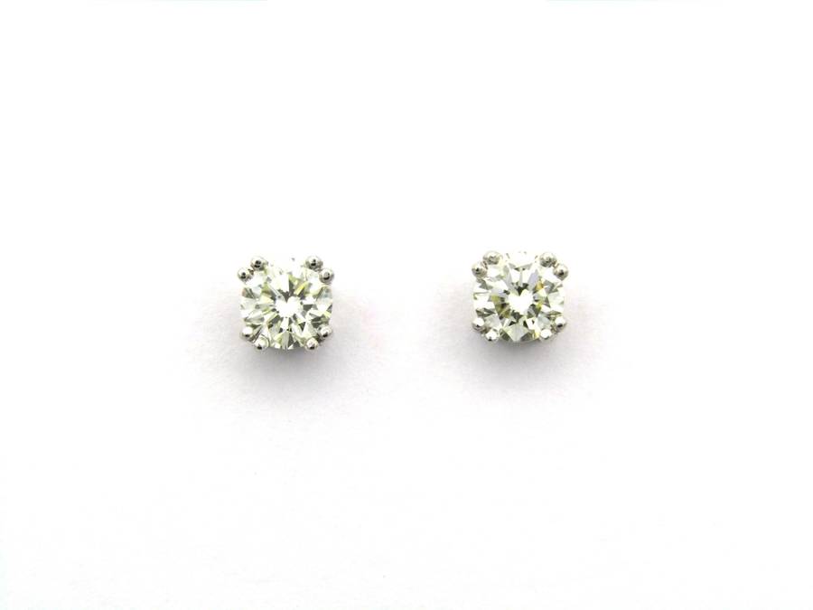 9K gold diamond studs.
