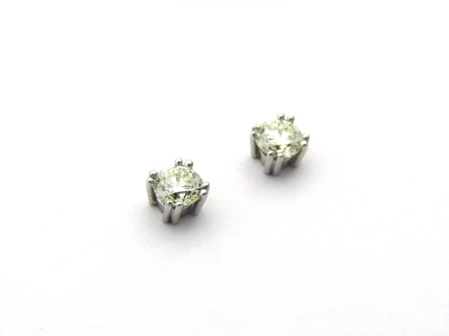 9K gold diamond studs.
