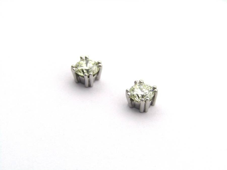 9K gold diamond studs.