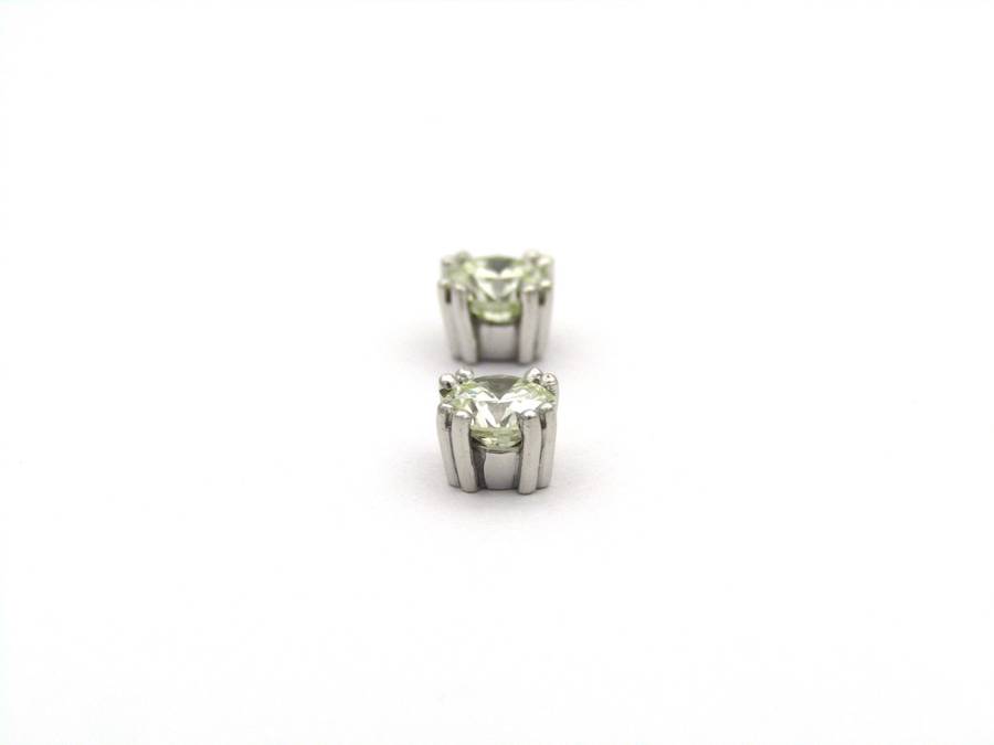 9K gold diamond studs.