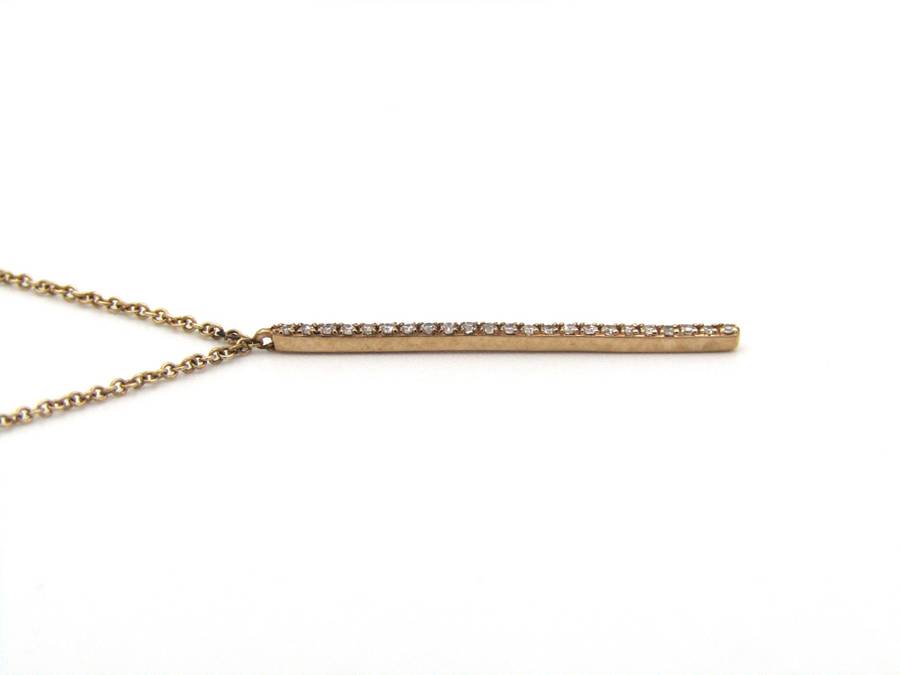 9K gold diamond bar necklace.