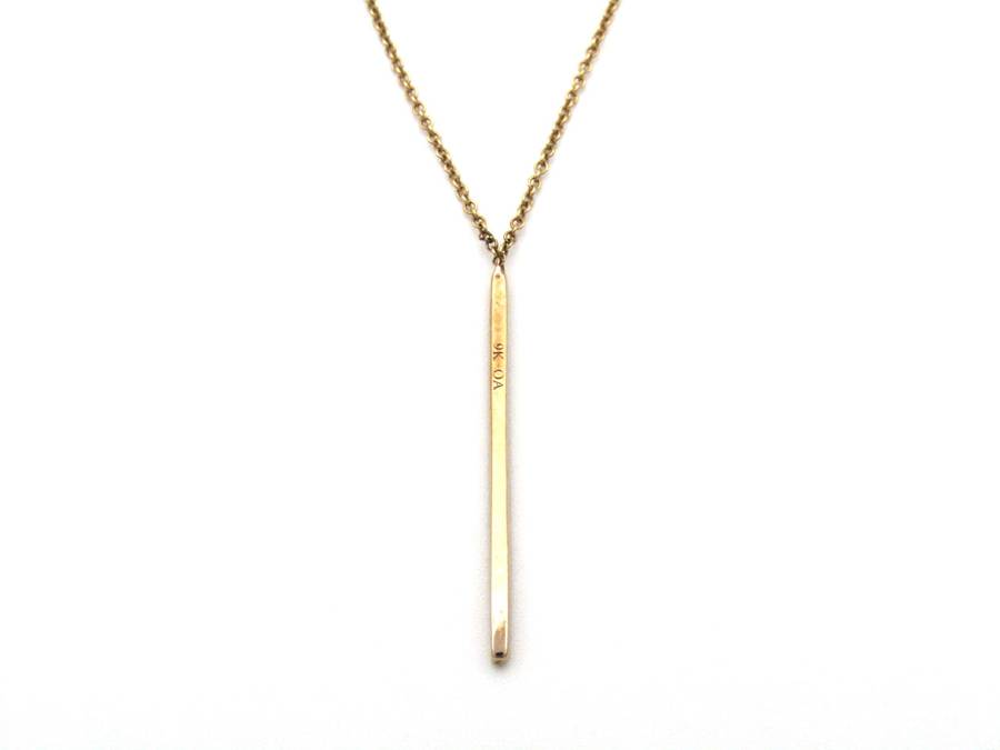 9K gold diamond bar necklace.
