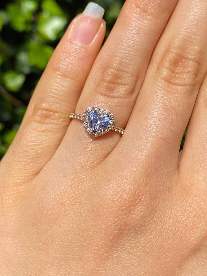 18K gold heart-shaped diamond halo ring.