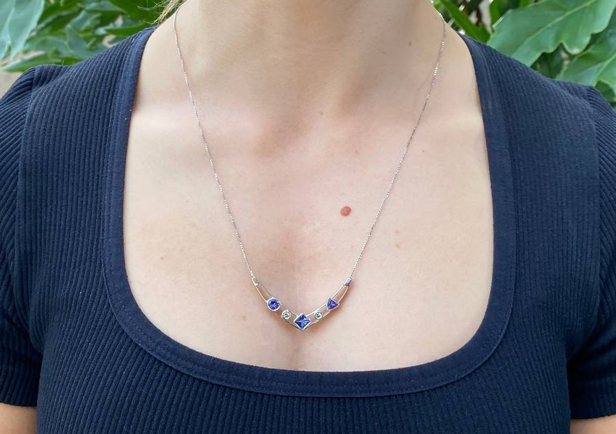 18K gold tanzanite and diamond necklace.