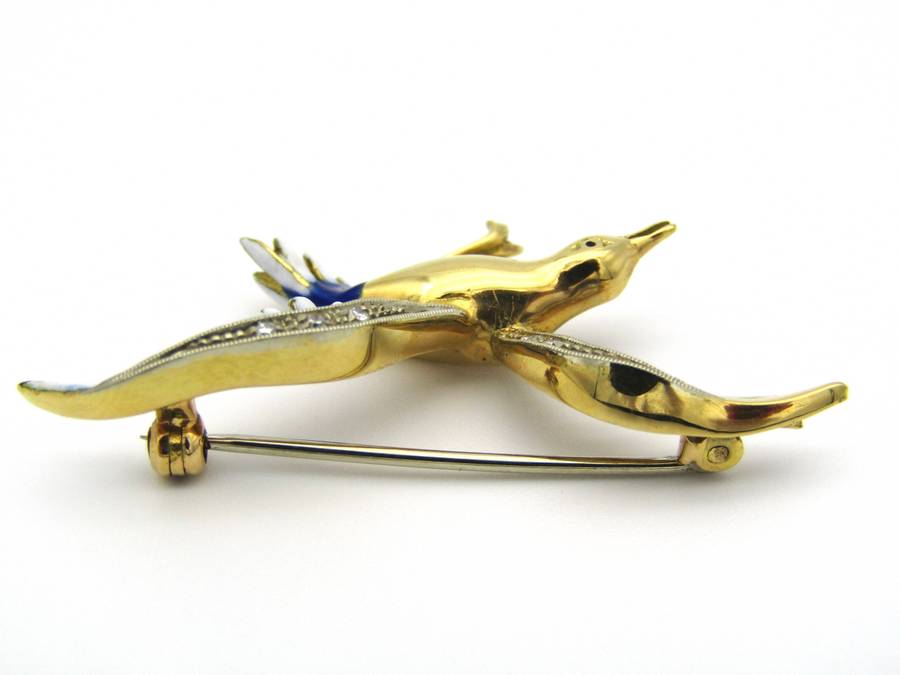 18K gold diamond and enamel "Bird in flight" brooch.