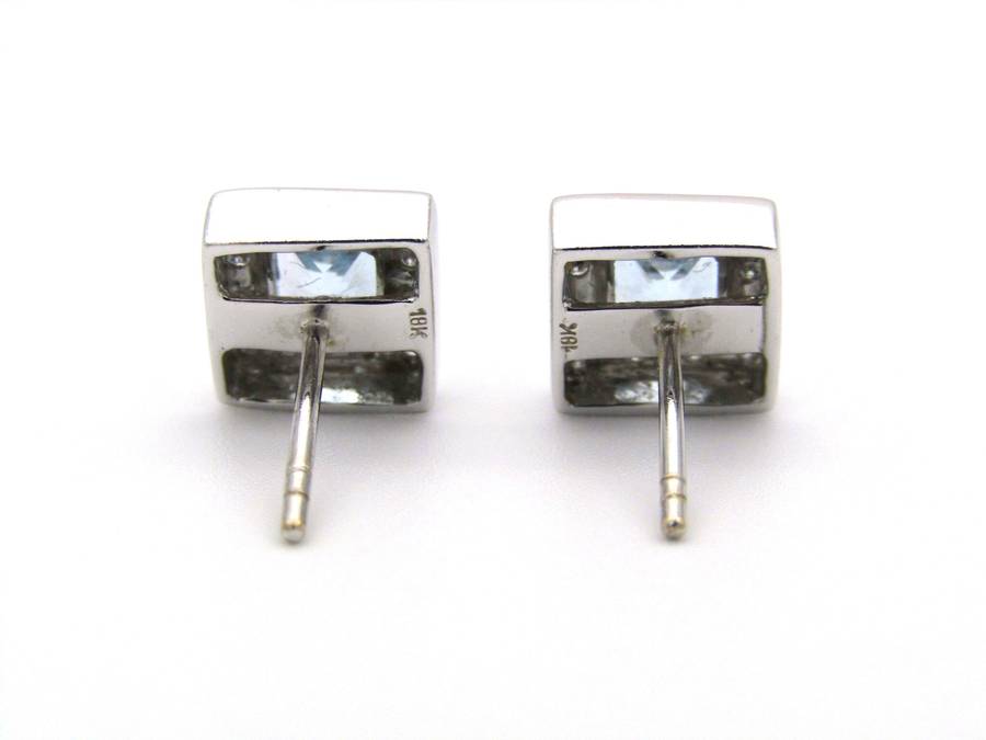 A pair of 18K gold Blue Topaz and diamond earrings.