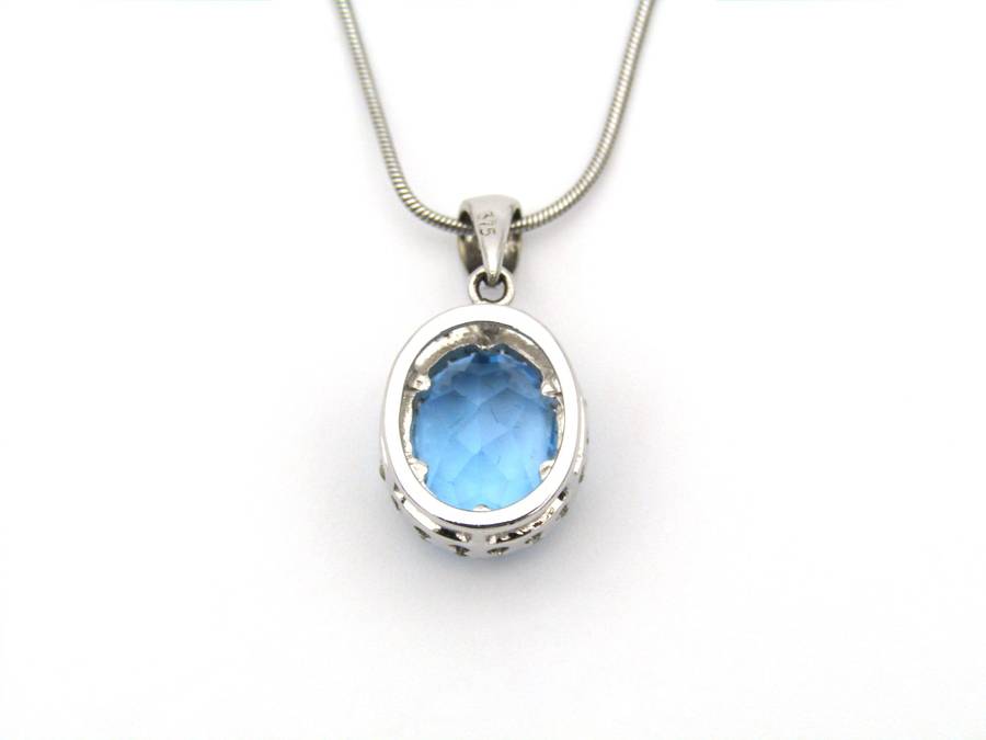 9K gold blue topaz and diamond pendant.