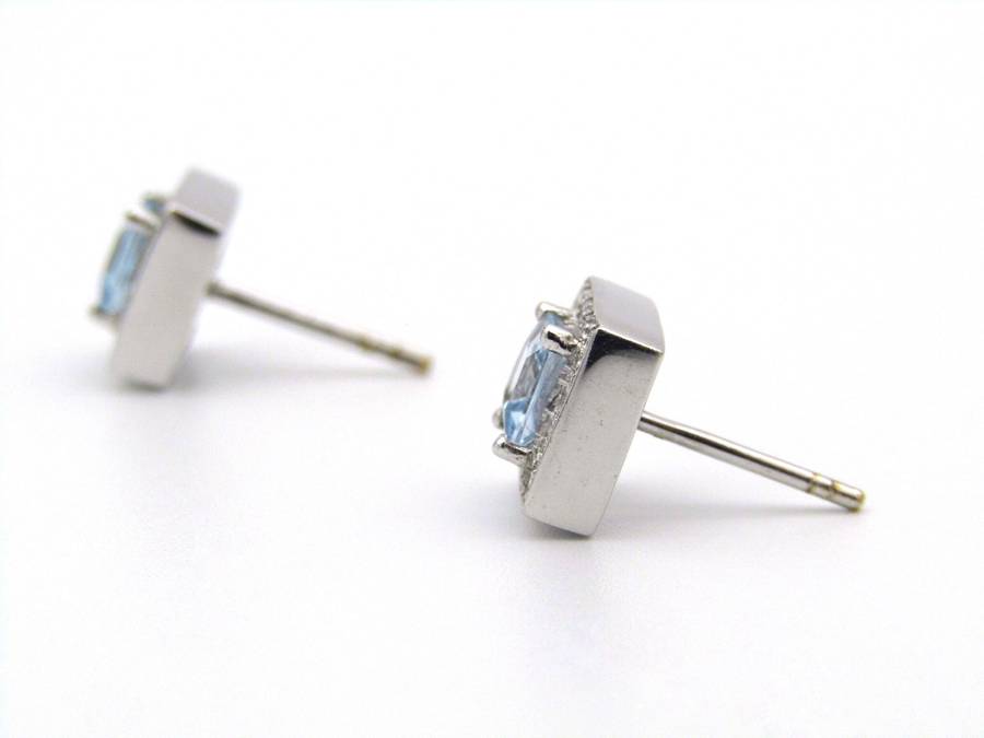 A pair of 18K gold Blue Topaz and diamond earrings.
