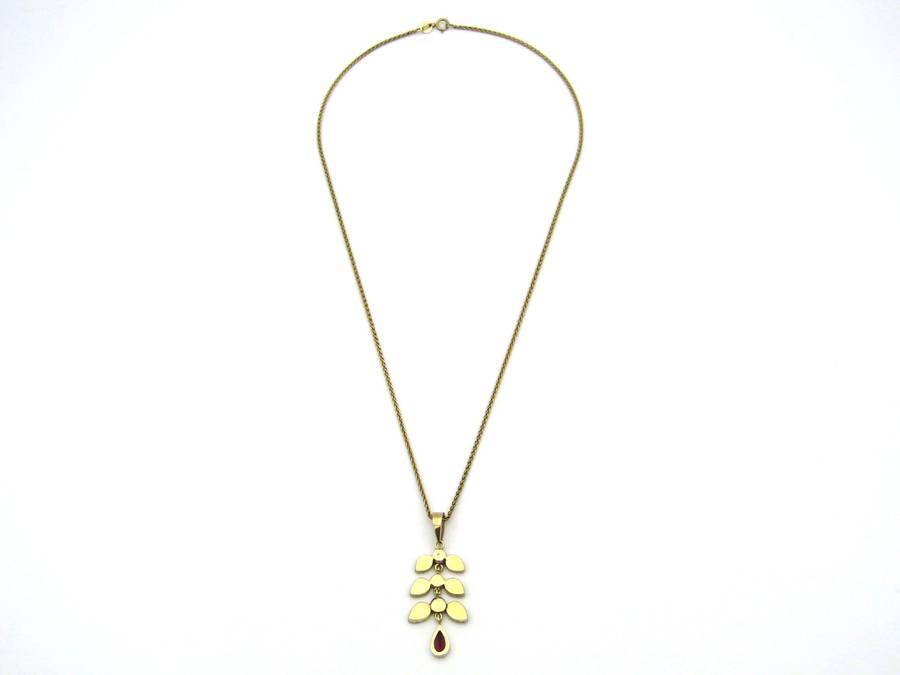 A Vintage 9K gold Almandine garnet and diamond pendant.
