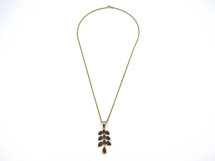 A Vintage 9K gold Almandine garnet and diamond pendant.