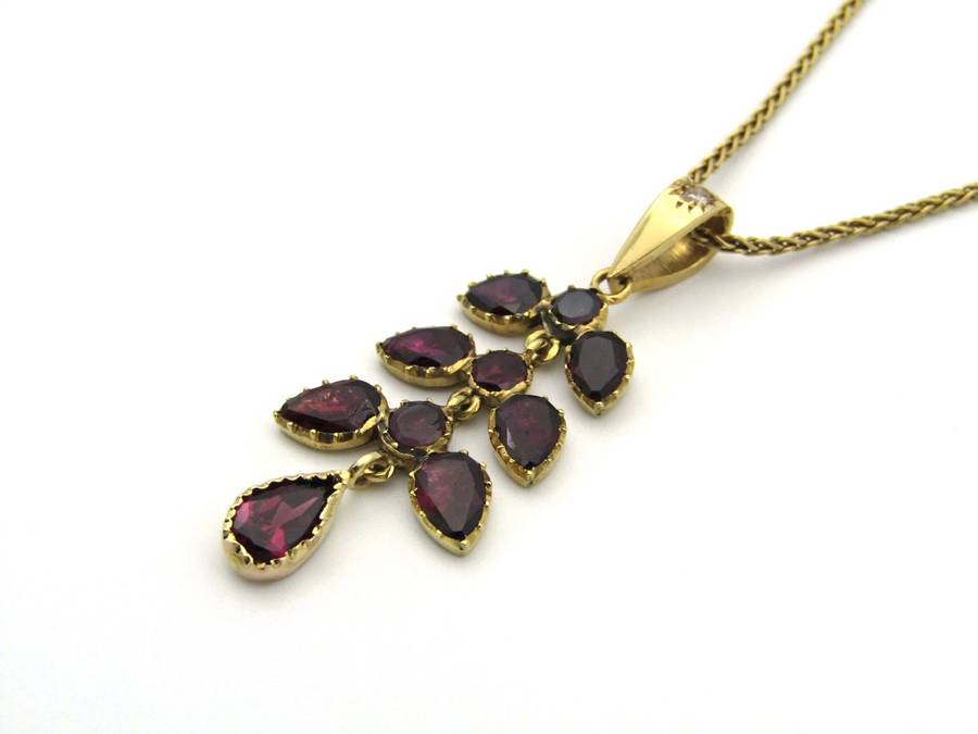 A Vintage 9K gold Almandine garnet and diamond pendant.