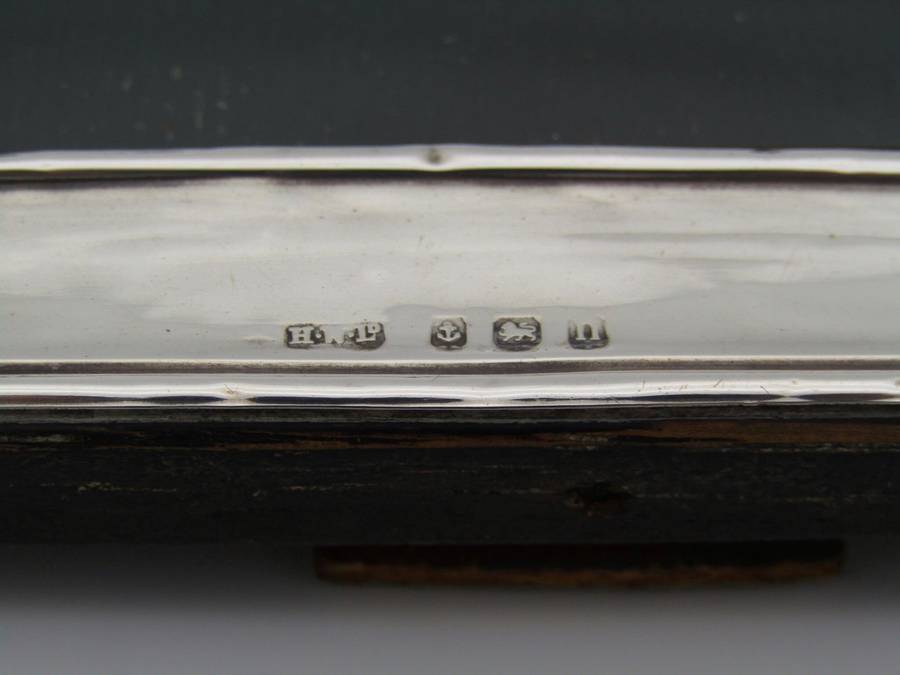 A sterling silver picture frame by Henry Williamson Ltd. Birmingham, 1912.