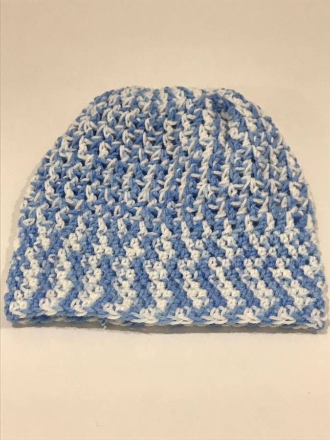 Hand knitted beanie with pony tale hole and boot cuffs
