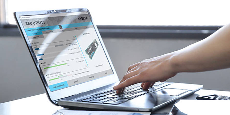 A man using a PC to check his SSD's health with the SSD Utility software