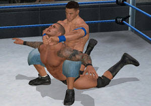 Cena locking a submission hold into place in WWE Smackdown vs Raw 2010 for Wii