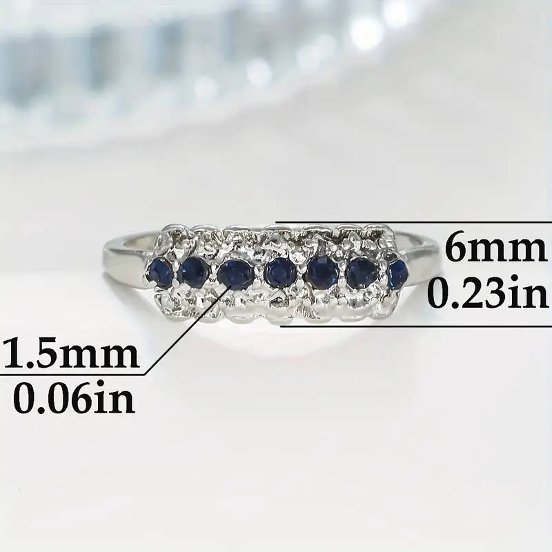 Synthetic Blue Sapphire Ring with Cubic Zirconia