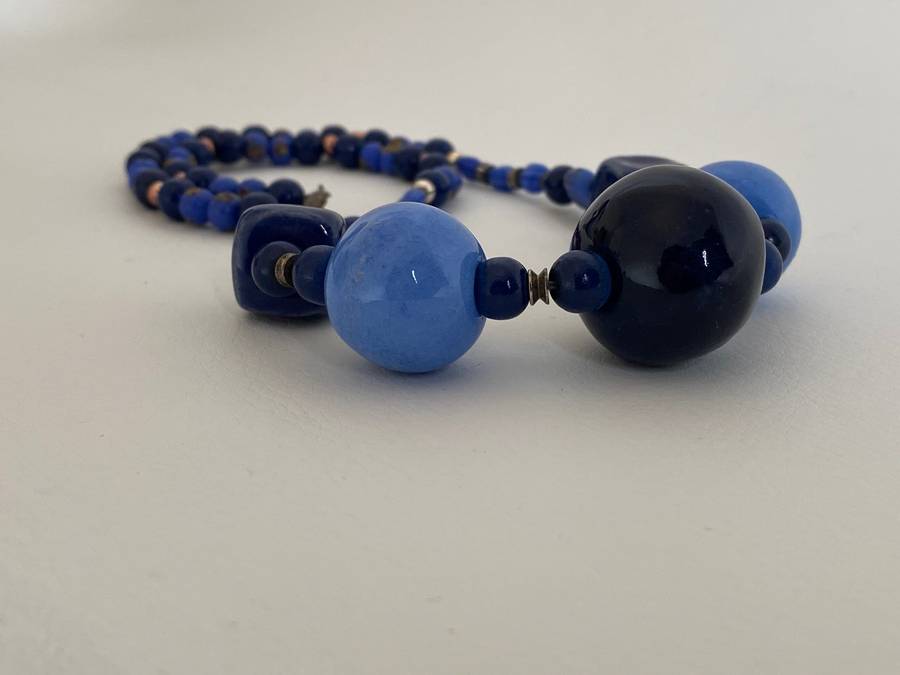 Necklace with Glass beads - Large blue round beads in the front with smaller blue beads in betwee...