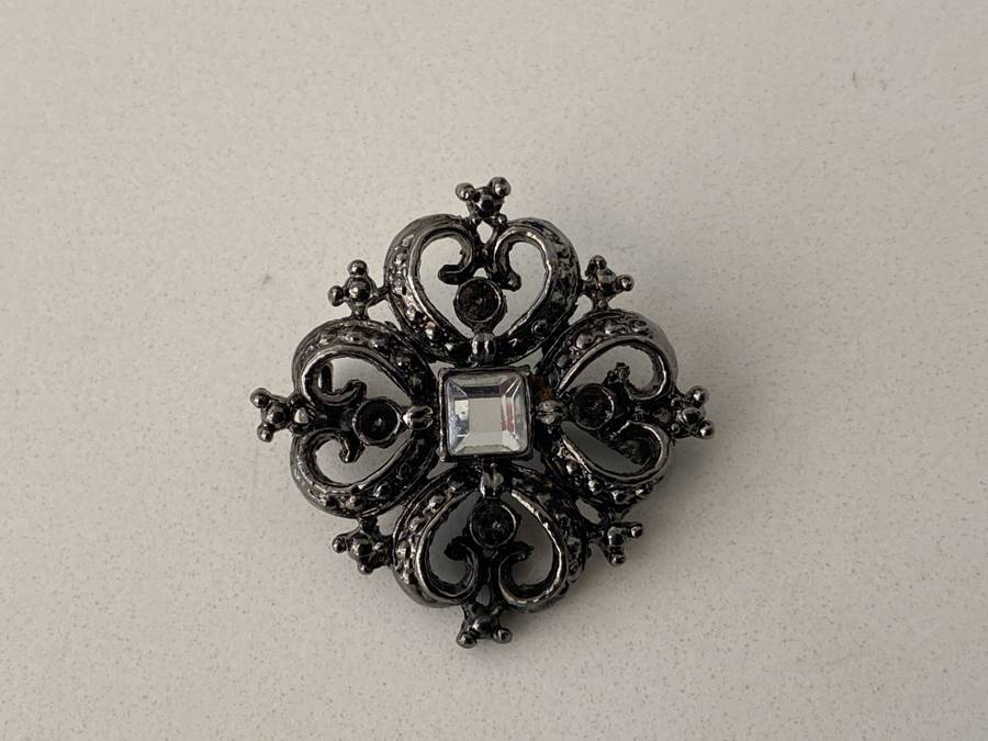 Brooch - Black Colour Square With Heart Shapes. Has A White Bead in Centre #ML681
