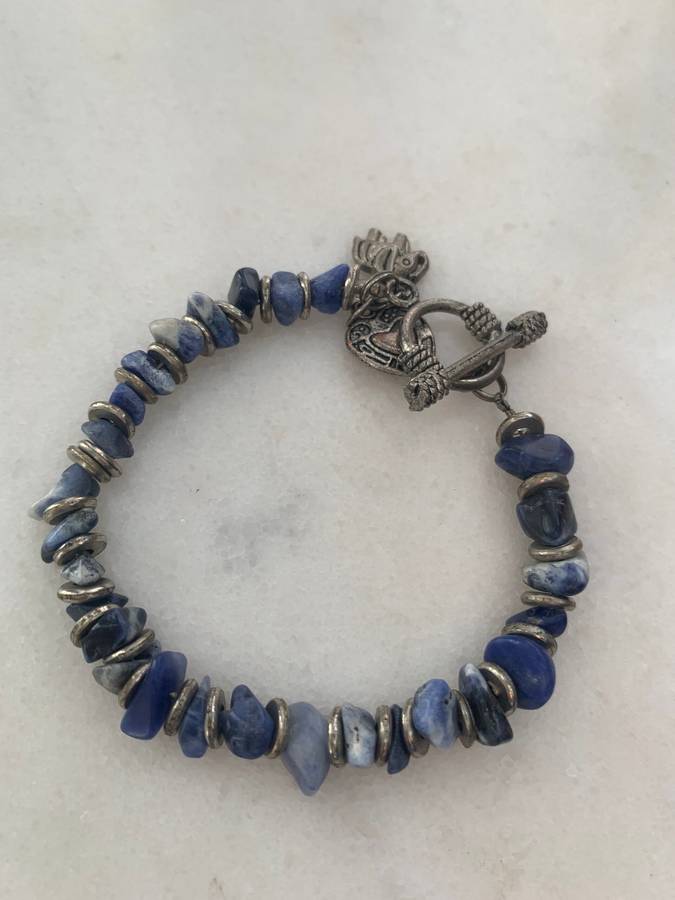 Bracelet With Irregular Shaped Blue Stones Split By Silver Coloured Round Beads With Pretty Clasp...
