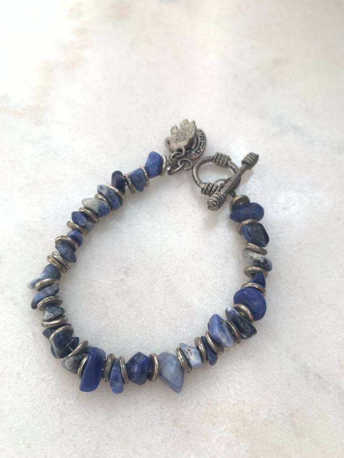 Bracelet With Irregular Shaped Blue Stones Split By Silver Coloured Round Beads With Pretty Clasp...