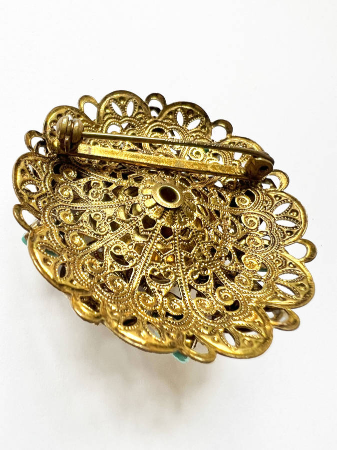 Brooch - Vintage Filigree Turquoise Design with small stones and large stone in the middle surrou...