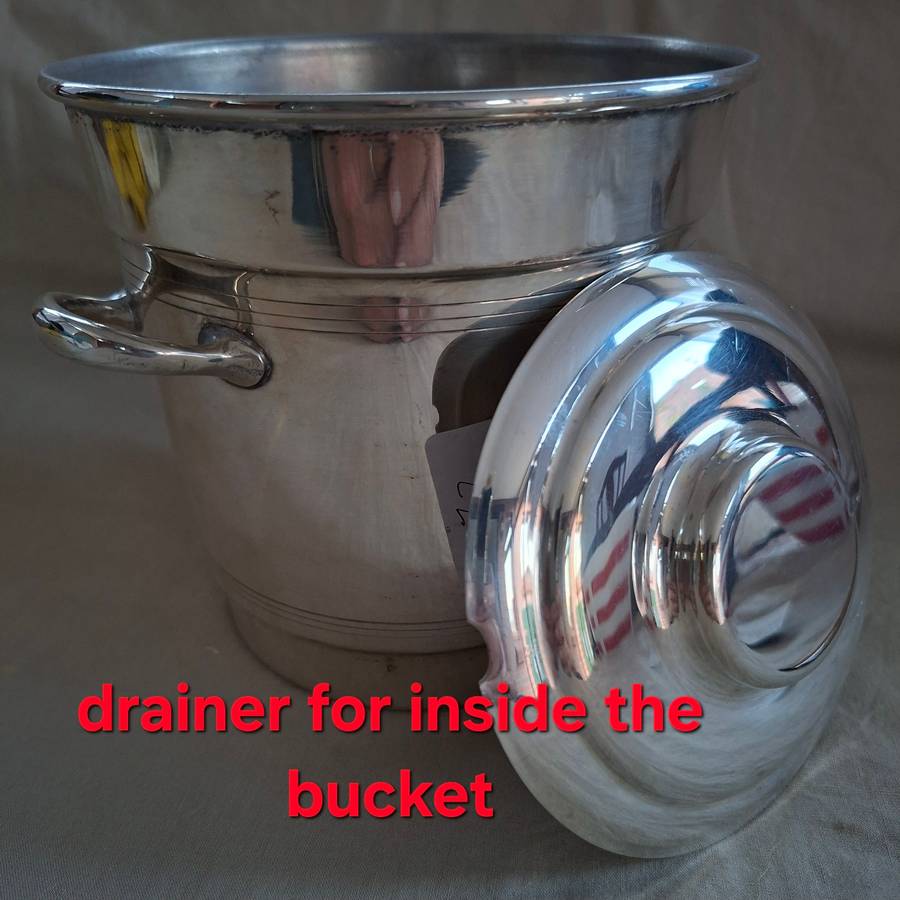 Silver plate ice bucket with tongs.   Quality Louis Silver plate with ice water drainer