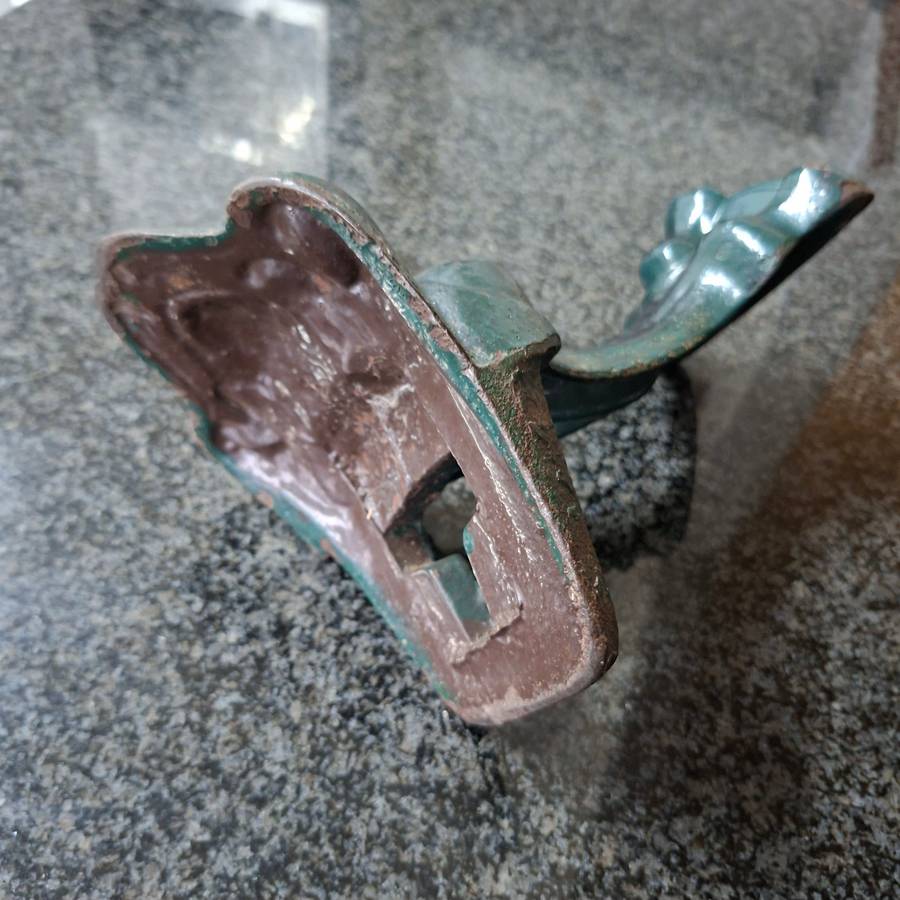 Old cast iron Door stop / leg from an antique bath.   Lions paw foot