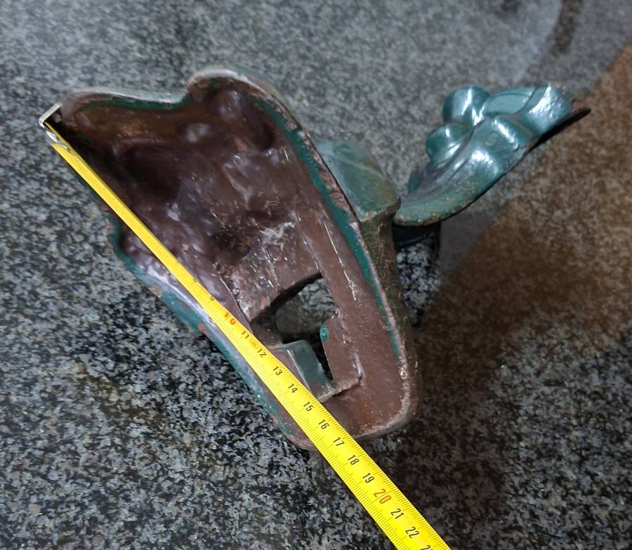Old cast iron Door stop / leg from an antique bath.   Lions paw foot