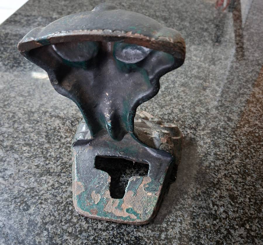 Old cast iron Door stop / leg from an antique bath.   Lions paw foot